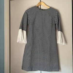 Elegant Black and White Geometric Pattern Dress with Pleated Bell Sleeves